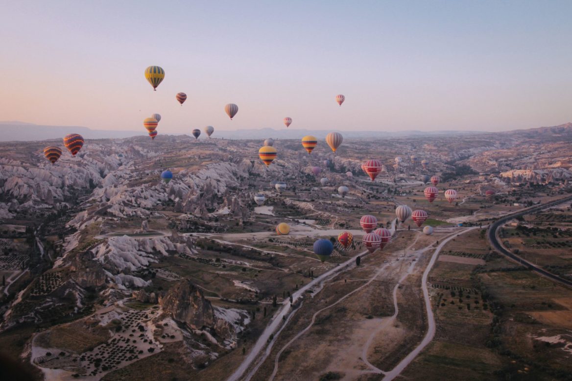 Hot Air Baloons Over Mountains
